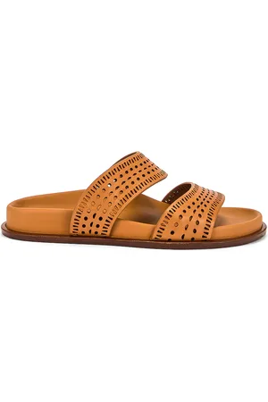 Alaïa Vienne Leather Slides in Tan