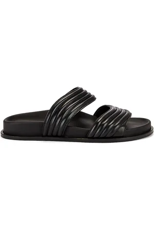 Alaïa Leather Slides in Black