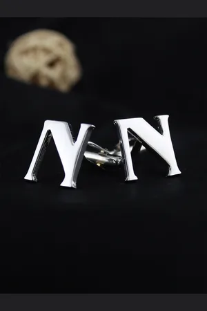PELUCHE Silver-Toned Alphabet Cufflink