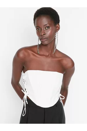 https://images.fashiola.in/product-list/300x450/myntra/100303142/women-off-white-solid-sleeveless-tube-top.webp