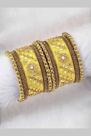 Peora Set of 10 Gold-Plated & Yellow Silk Thread Handcrafted Kundan Bangles