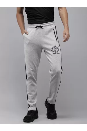 SPYKAR Men Solid Applique Slim Fit Track Pants With Side Stripes