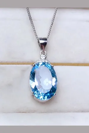 Designs & You Silver-Plated American Diamond Studded Oval Shaped Pendant