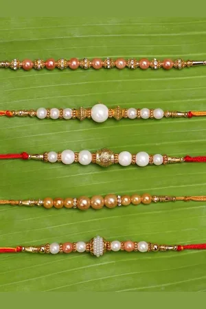 eCraftIndia Set of 5 White & Golden Pearls Rakhis With Roli Chawal Pack