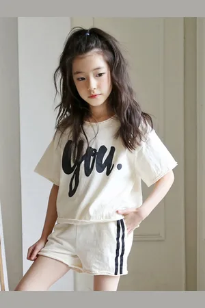 Stylecast Girls Beige & Black Printed T-shirt With Shorts