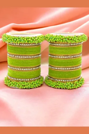 Leshya Set Of 64 Brass Plated Stone Studded & Beaded Bangles