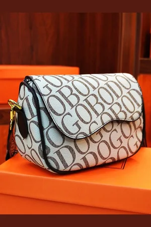 Diva Dale Textured PU Structured Sling Bag with Tasselled