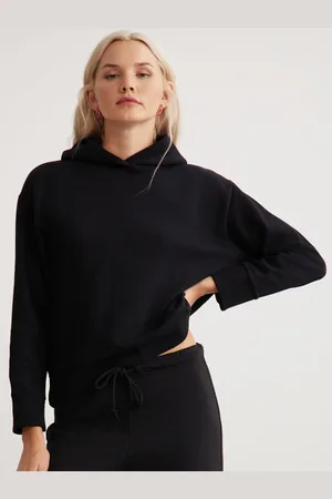 Grimelange Women Solid Hooded Sweatshirt