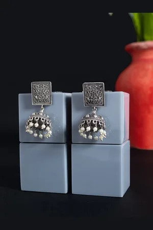 Golden Peacock Silver-Toned & White Dome Shaped Jhumkas Earrings