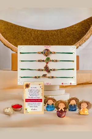 eCraftIndia Set of 4 Designer Rakhis With Baby Monk Buddha Statues
