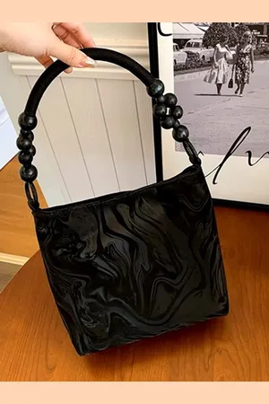Stylecast Textured Bucket Handheld Bag with Tasselled