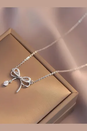 KARISHMA KREATIONS Stainless Steel Silver-Plated CZ Bowknot Contemporary Pendant