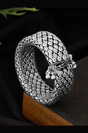 ATIBELLE German Silver Plated & Ghungroo Studded Floral Textured Bangle