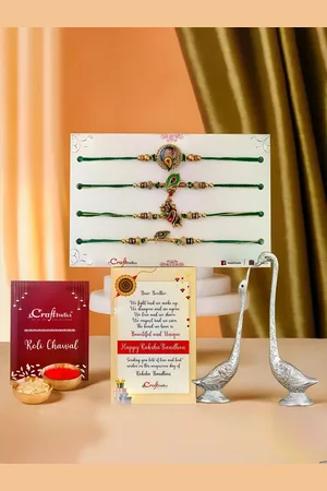 eCraftIndia Set Of 6 Rakhis With Swan Statues & Roli Chawal