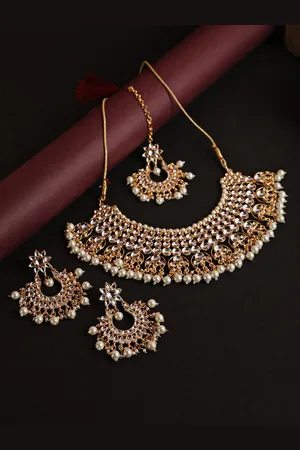 Jazz and Sizzle Gold-Plated White Kundan & Bead StuddedvJewellery Set With Maang Tika