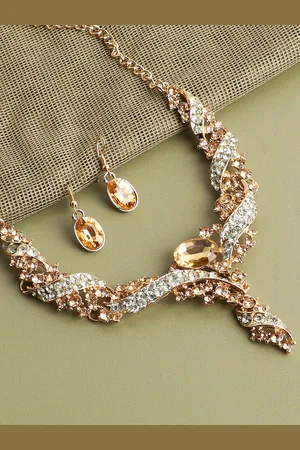 SOHI Women Gold-Plated & White Artificial Stones Studded Jewellery Set