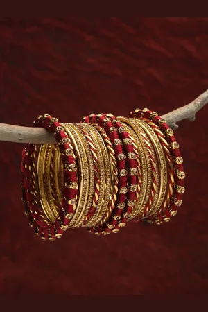 Shining Diva Set Of 26 Gold Plated Maroon Crystal Studded Bangle Set