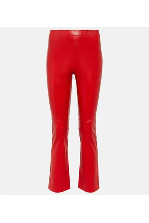 Premium Photo | Woman in red leather trousers