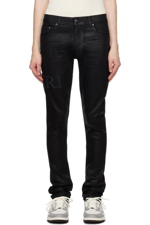 AMIRI Black Serif Logo Wax Skinny Jeans
