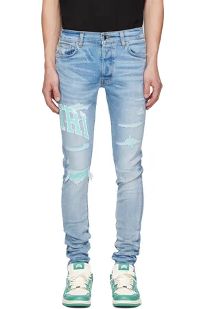 AMIRI Blue Embroidered Varsity Logo Repair Jeans